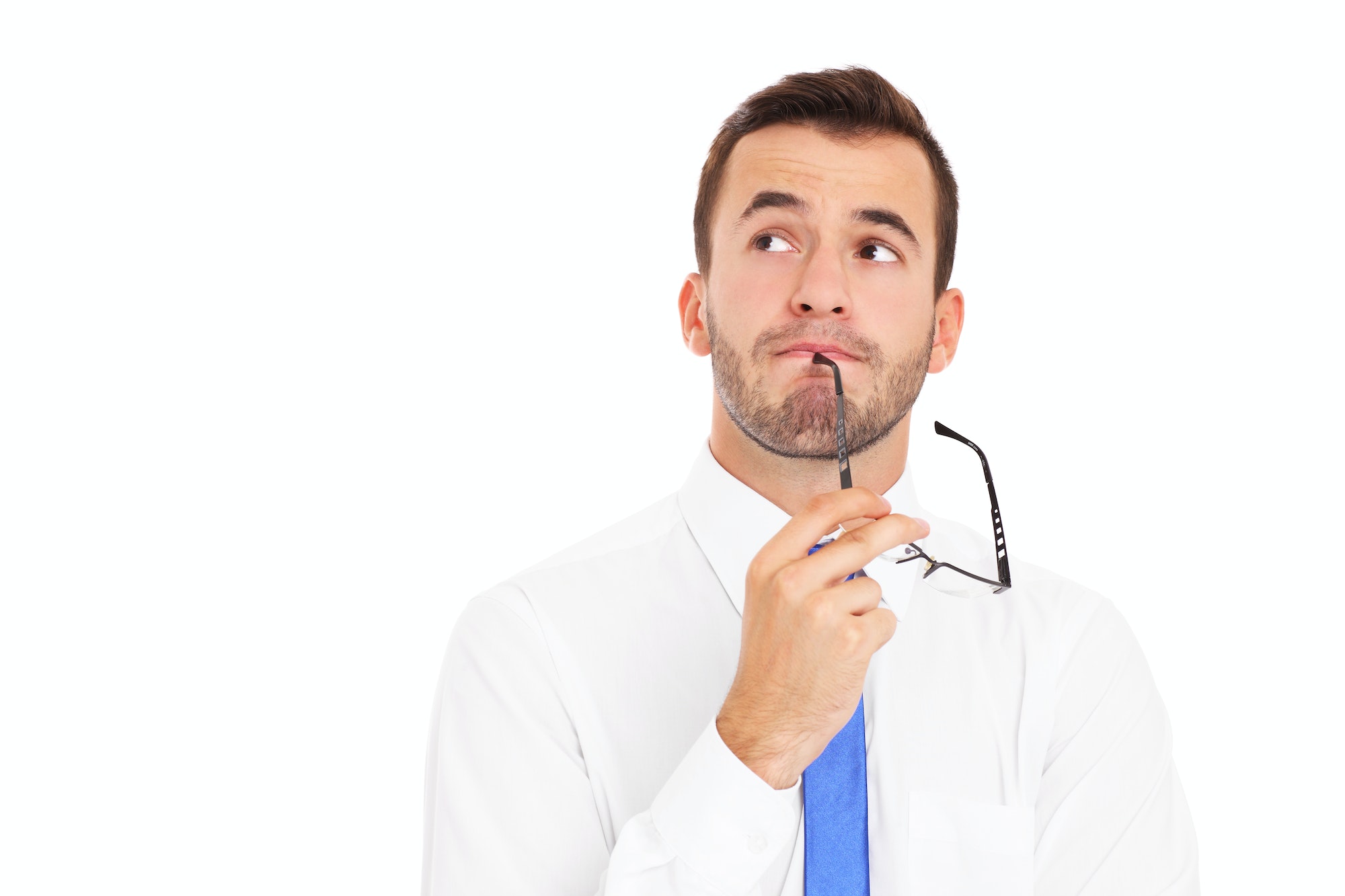 Young businessman thinking over white background